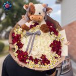 Gift Bouquet with Doll floral gift arrangement for birthdays and special occasions in Milan