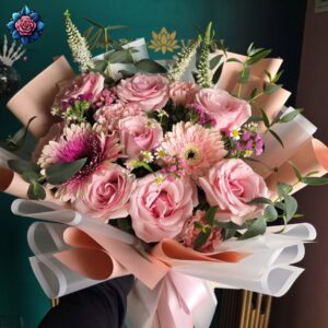Light Pink Rose Bouquet for Gift with blush roses, pink gerberas and carnations in pastel wrapping with eucalyptus.