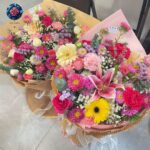 Mix Bouquet 034 photo with pink lilies, roses, yellow gerbera daisies, carnations and colorful mixed flowers.