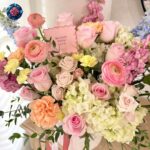 Image ALT Text: Mix Bouquet Roses Luxury with pink roses, ranunculus, cream hydrangeas and pastel flowers in Milan