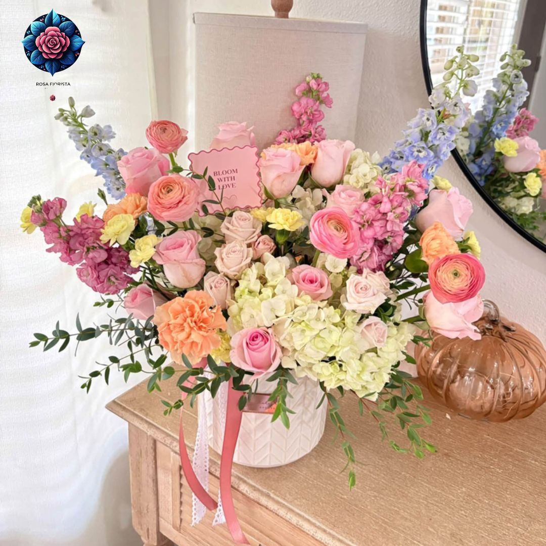 Image ALT Text: Mix Bouquet Roses Luxury with pink roses, ranunculus, cream hydrangeas and pastel flowers in Milan