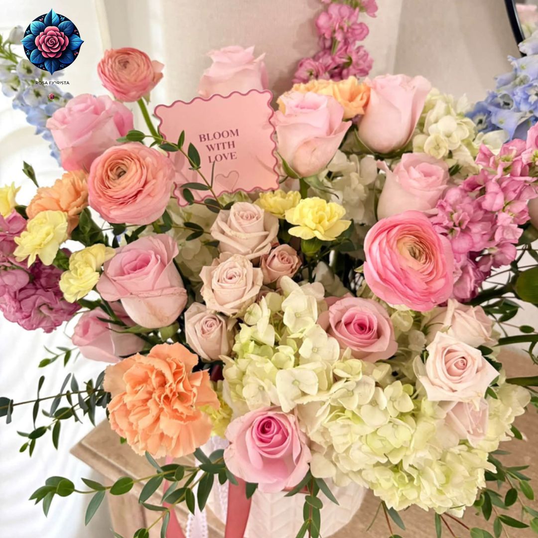 Image ALT Text: Mix Bouquet Roses Luxury with pink roses, ranunculus, cream hydrangeas and pastel flowers in Milan