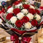 Mix Bouquet for Luxury Gift with red and ivory roses, gypsophila and black-gold wrapping with a burgundy bow.