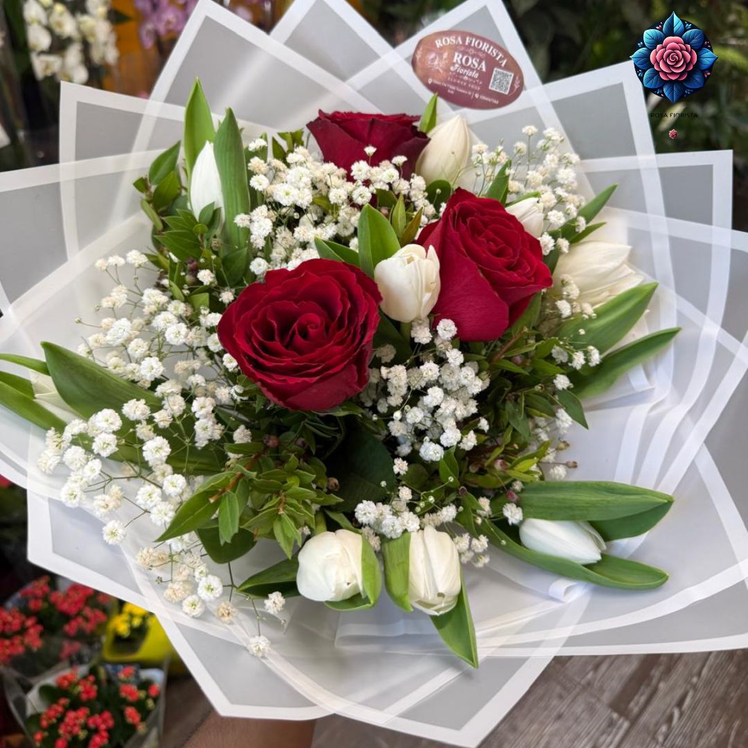Rosa Tulipani Mix | Elegant Rose and Tulip Bouquet in Milan Fresh Roses and Tulips in One Elegant Bouquet Rosa Tulipani Mix combines the classic beauty of roses with the fresh and elegant appearance of tulips. The contrast between these two popular flowers creates a balanced and attractive floral arrangement suitable for different occasions. The combination of flower shapes and seasonal colours gives the bouquet a natural and sophisticated appearance. Whether you want to surprise someone special or send a beautiful floral gift in Milan, Rosa Tulipani Mix offers a versatile choice for meaningful moments. Explore more floral designs in Flower Bouquets Milan. What Is Included? The bouquet includes: - Fresh roses - Fresh tulips - Professional bouquet arrangement - Decorative greenery where available The exact flower varieties, colours, quantity and arrangement style may vary depending on seasonal availability. Bouquet Information Each Rosa Tulipani Mix is prepared according to the availability of fresh flowers to create a beautiful and balanced arrangement. For specific flower preferences or custom arrangements, contact Rosa Fiorista to check the available options. Create a Personalised Flower Arrangement Rosa Tulipani Mix is a beautiful option for customers who want the elegance of roses combined with the freshness of tulips. Flower Combination Ideas The arrangement can be complemented with: - White roses - Red roses - Pink roses - Yellow tulips - Orange tulips - White tulips - Lisianthus - Seasonal flowers - Decorative greenery The combination of roses and tulips creates a versatile floral style suitable for both romantic and celebratory occasions. Perfect for Special Occasions Birthday and Celebration Flowers A mixed rose and tulip bouquet is a thoughtful way to celebrate birthdays and joyful occasions. Rosa Tulipani Mix is suitable for: - Birthdays - Congratulations - Friendship gifts - Thank-you gifts - Special celebrations Explore more birthday options through Birthday Flowers Milan. Romantic Gifts and Anniversaries Roses and tulips create an elegant combination for expressing affection, appreciation and warm feelings. This bouquet is suitable for: - Anniversaries - Romantic surprises - Date celebrations - Meaningful personal moments Explore more romantic arrangements through Romantic Flowers Milan. Weddings and Elegant Events The combination of roses and tulips can add a refined floral touch to weddings and special events. Suitable uses include: - Wedding bouquets - Wedding gifts - Reception decorations - Table arrangements - Event styling Discover more wedding flowers through Wedding Flowers Milan. Fresh Flower Delivery in Milan Rosa Fiorista prepares each Rosa Tulipani Mix order according to selected arrangement style and current flower availability. Delivery Available For: - Homes - Offices - Hotels - Restaurants - Event venues Same-day delivery may be available depending on order time, destination and flower availability. Explore more products through Flowers Milan. How to Care for Rose and Tulip Bouquets Flower Care Tips To keep your Rosa Tulipani Mix fresh: - Place the bouquet in a clean vase with fresh water - Trim the stems before placing them in water - Remove leaves below the water level - Change the water regularly - Keep the flowers away from excessive heat - Avoid placing the bouquet in direct sunlight Proper care helps maintain the freshness and natural beauty of both roses and tulips for longer. Related Flower Products For a fresh mixed bouquet: Mix Bouquet 010 For a pink tulip bouquet: Pink Tulipani Bouquet For a bicolor tulip: Tulipani Bicolore Per Pieces For an orange tulip: Aransone Tulipani Per Pieces Frequently Asked Questions (FAQ) What is Rosa Tulipani Mix? Rosa Tulipani Mix is a mixed flower bouquet combining fresh roses and tulips in an elegant floral arrangement. What flowers are included in Rosa Tulipani Mix? The bouquet includes roses and tulips. Exact varieties, colours and quantities depend on seasonal availability. Can I customise Rosa Tulipani Mix? Customisation may be available depending on the flowers currently in stock. Contact Rosa Fiorista to check available options. What occasions are suitable for Rosa Tulipani Mix? This mixed bouquet is suitable for birthdays, anniversaries, romantic gifts, weddings, congratulations and other special celebrations. How should I care for the bouquet? Place the flowers in fresh water, trim the stems regularly, change the water and keep the bouquet away from excessive heat and direct sunlight. Is flower delivery available in Milan? Yes, fresh bouquet delivery can be arranged to available Milan locations depending on order timing and flower availability.